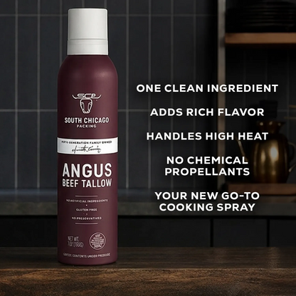 A can of South Chicago Packing Angus Beef Tallow cooking spray stands on a wooden countertop in a kitchen setting, with bold white text on the right describing its clean ingredient, rich flavor, high heat handling, no chemical propellants, and status as a go-to cooking spray.